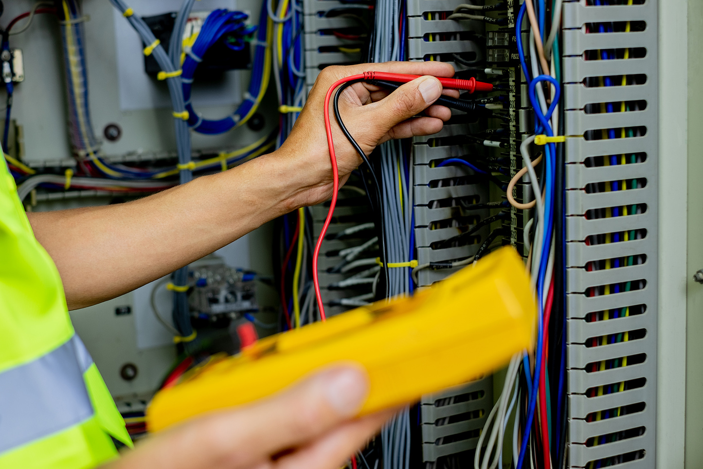 Electrical Engineer Inspecting Switchgear Cabinet